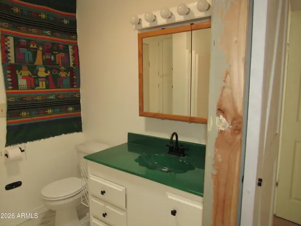 a view of a backyard house and swimming pool