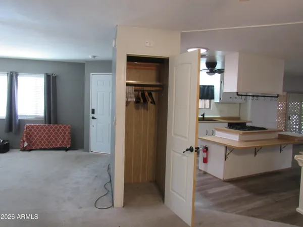 a kitchen with a refrigerator and a sink