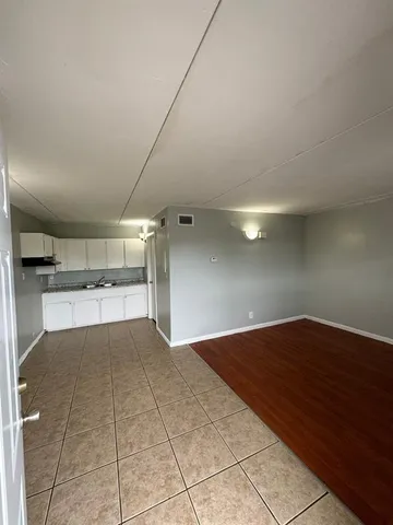 a view of a room with a wooden floor