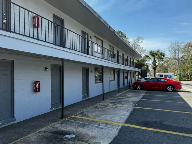 a view of a car park in front of a building