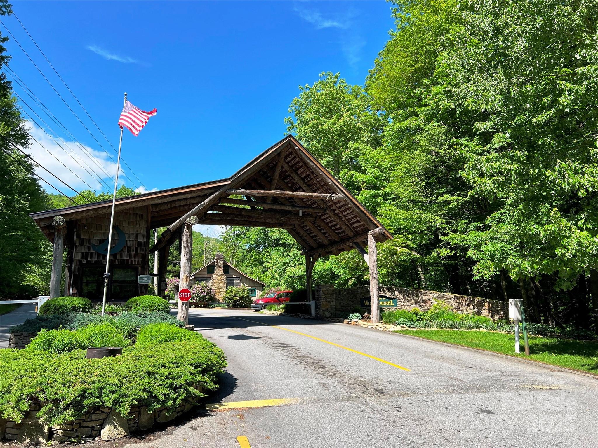 Tbd Goldenleaf Road, Unit 74 Mars Hill, NC 28754 - Photo 2 of 17 a car parked in front of a house and a yard