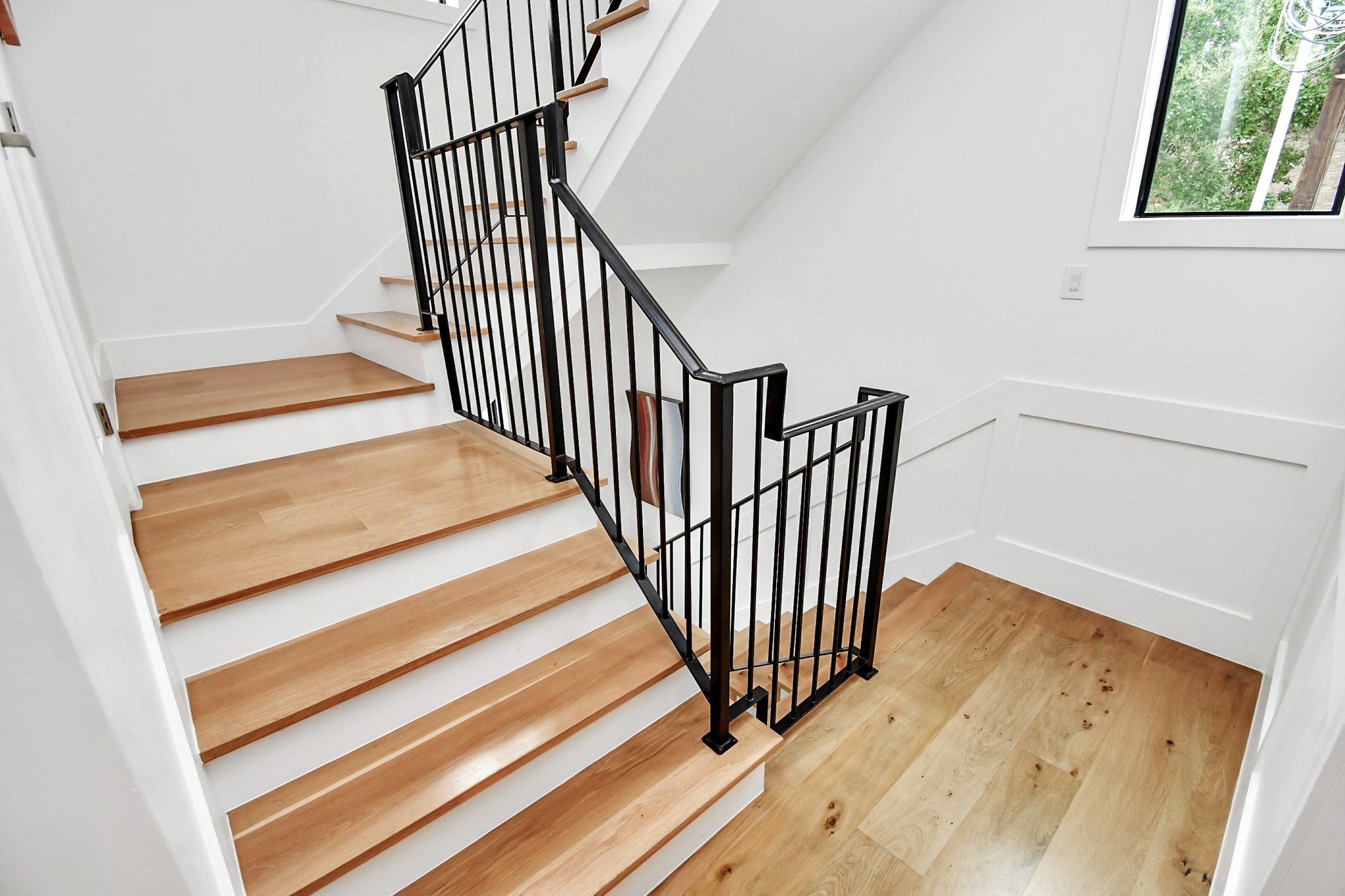 2303 Yupon Street Houston, TX 77006 - Photo 26 of 46 Elegant Stair Case to 3rd floor where you will find the luxurious primary suite and additional bedroom with full bath.