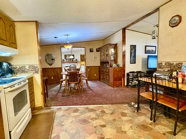 a dining room with furniture and window