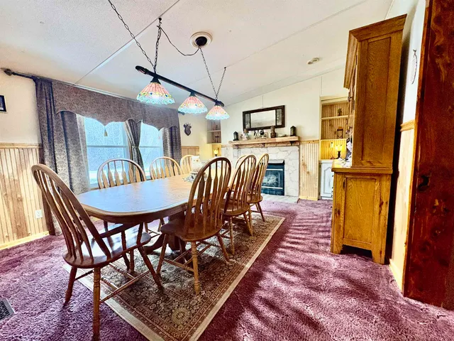 a fireplace with a sink and a mirror