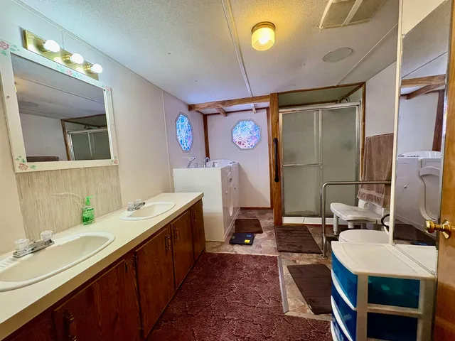 a view of a room with wooden floor and cabinet
