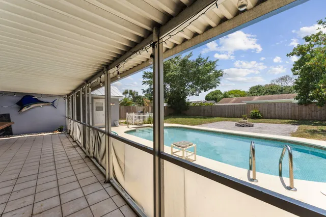 a view of swimming pool with outdoor seating