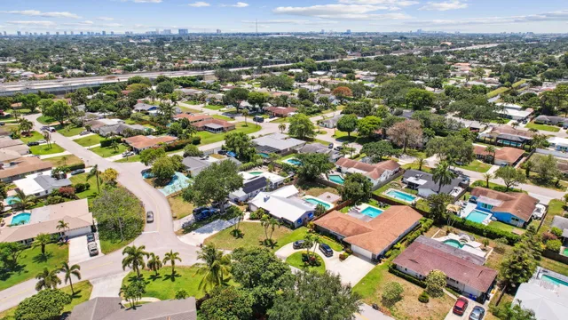 an aerial view of residential houses with outdoor space
