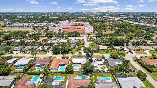 an aerial view of residential houses with outdoor space