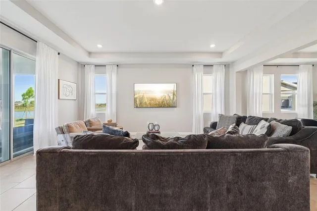 a living room with furniture and a window