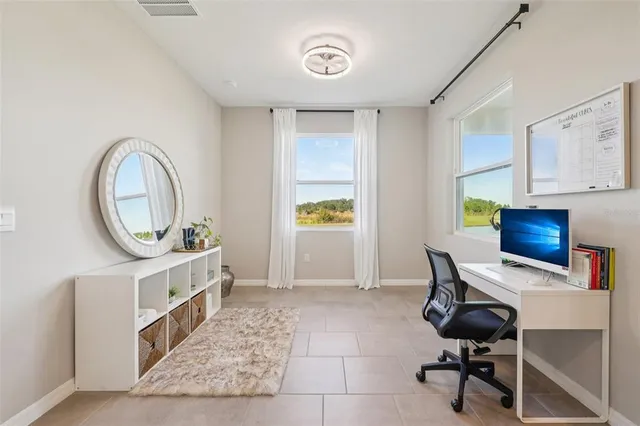 a view of kitchen with furniture and refrigerator