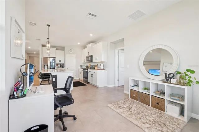 a living room with furniture and a window