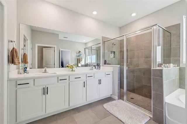 an aerial view of residential houses with yard