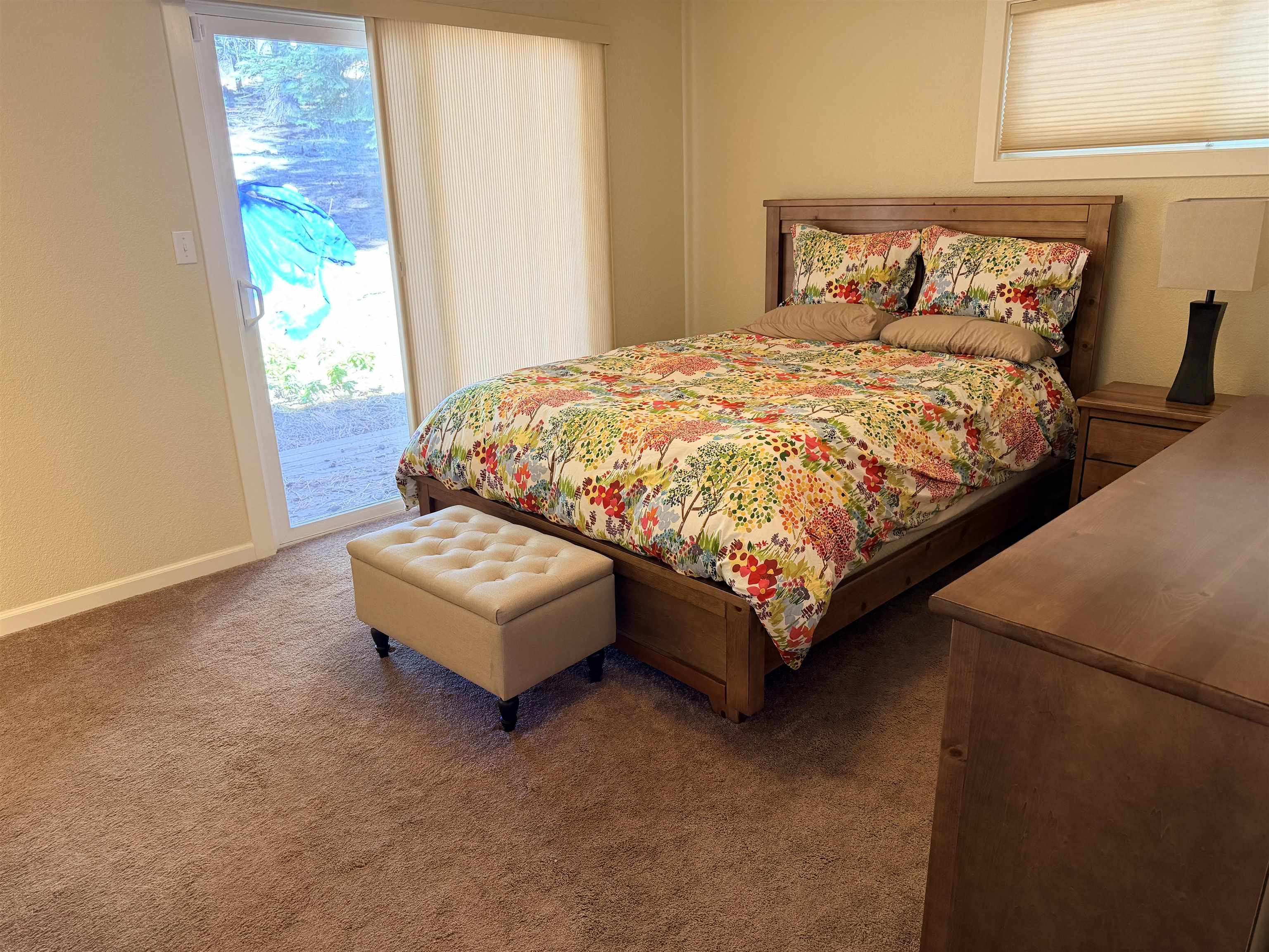 831 Timber Ridge Road Lake Almanor, CA 96137 - Photo 18 of 36 a bed sitting in a bedroom next to a window