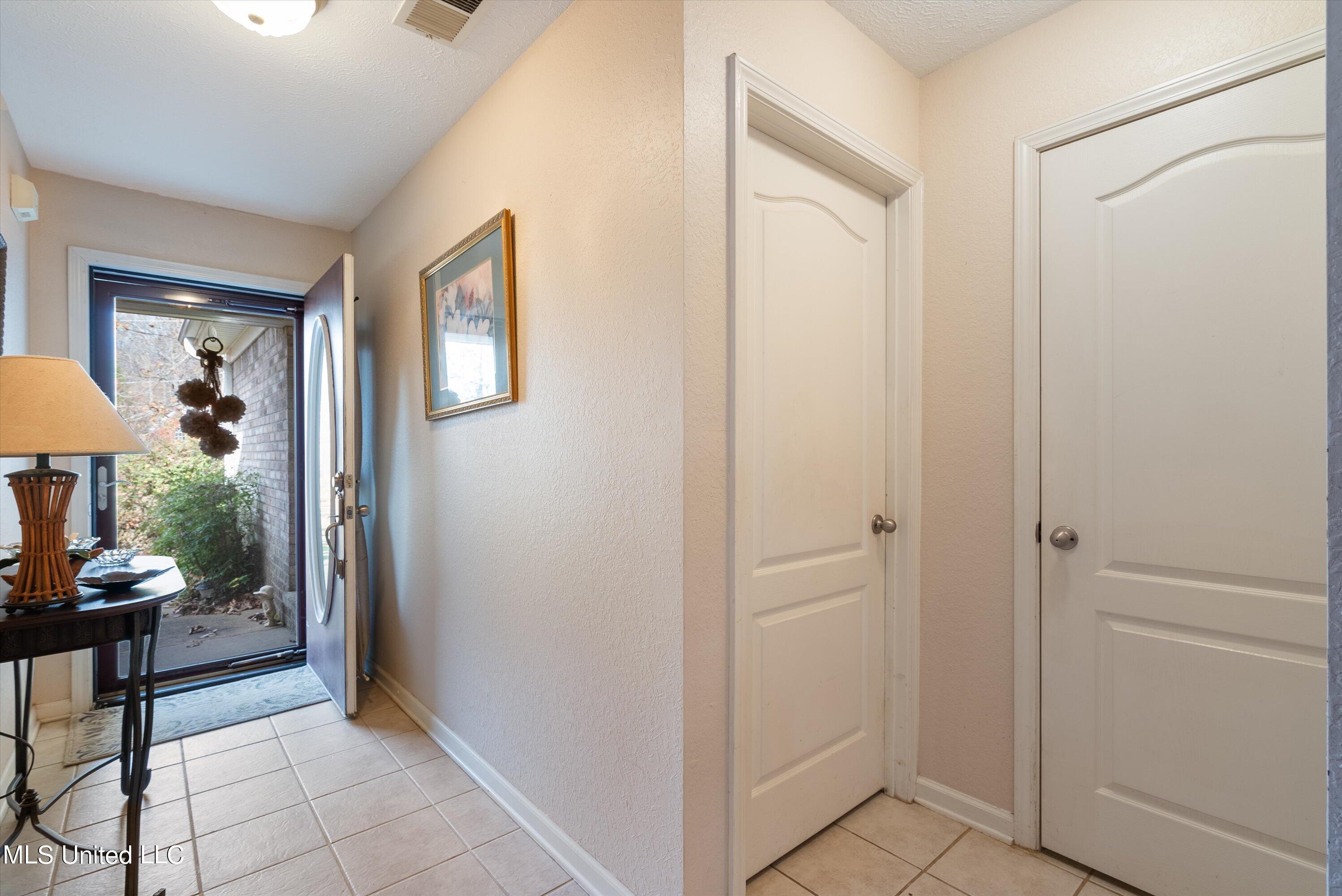 57 Timber Ridge Drive Byhalia, MS 38611 - Photo 3 of 30 03-Foyer to Laundry & Stairs