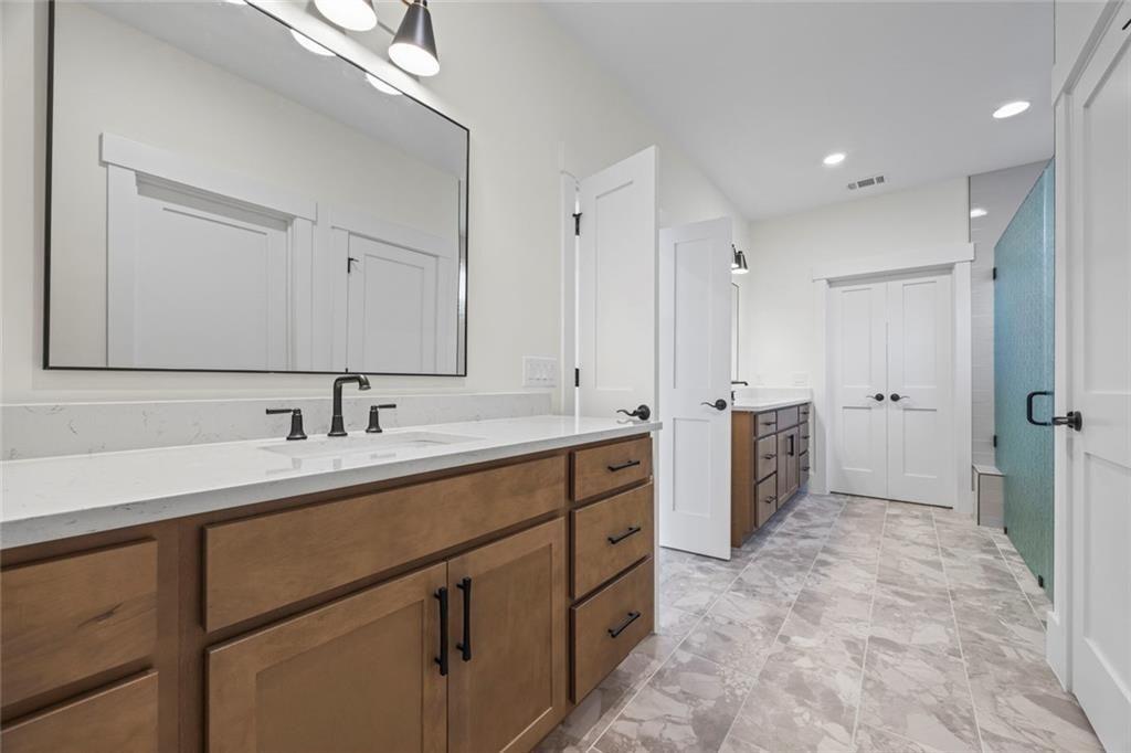 575 Hardy Road Martin, GA 30557 - Photo 13 of 16 a bathroom with a double vanity sink mirror and double