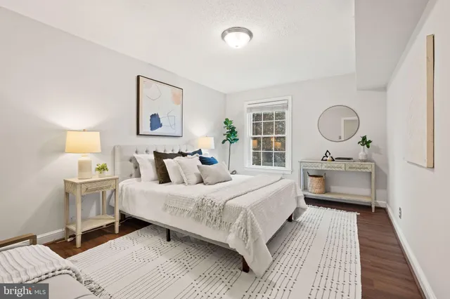 a bedroom with a bed and a table