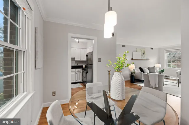 a view of a dining room with furniture window and wooden floor