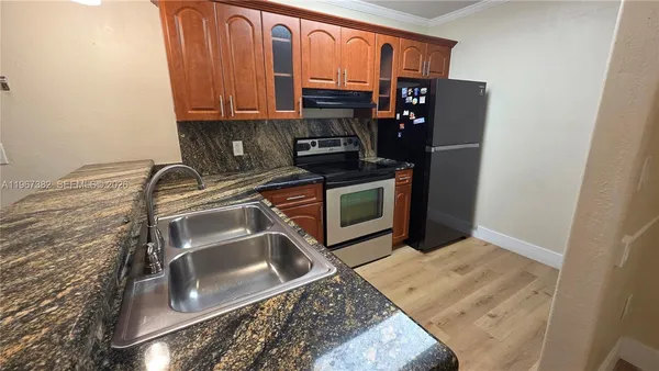 a kitchen with a stove and a microwave