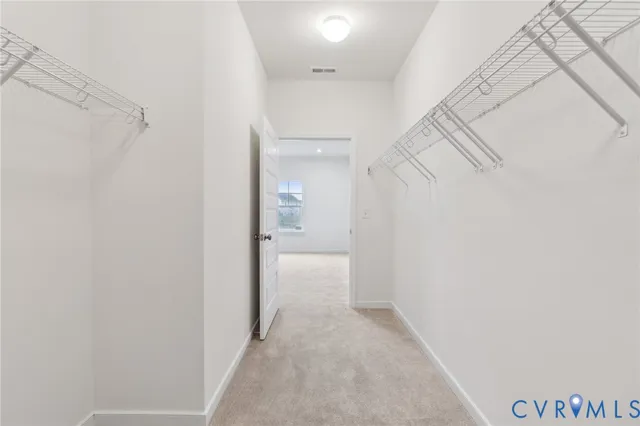 a view of a room with white walls