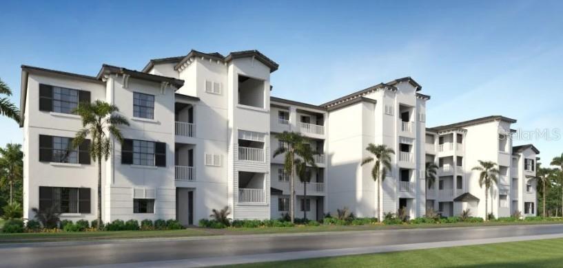 19116 Scallop Loop, Unit 303 Lakewood Ranch, FL 34211 - Photo 1 of 1 a view of a big yard in front of a building