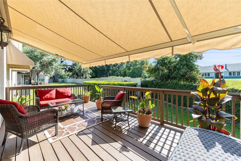 3304 Southwest 38th Street Ocala, FL 34474 - Photo 5 of 21 a balcony with wooden floor and outdoor seating