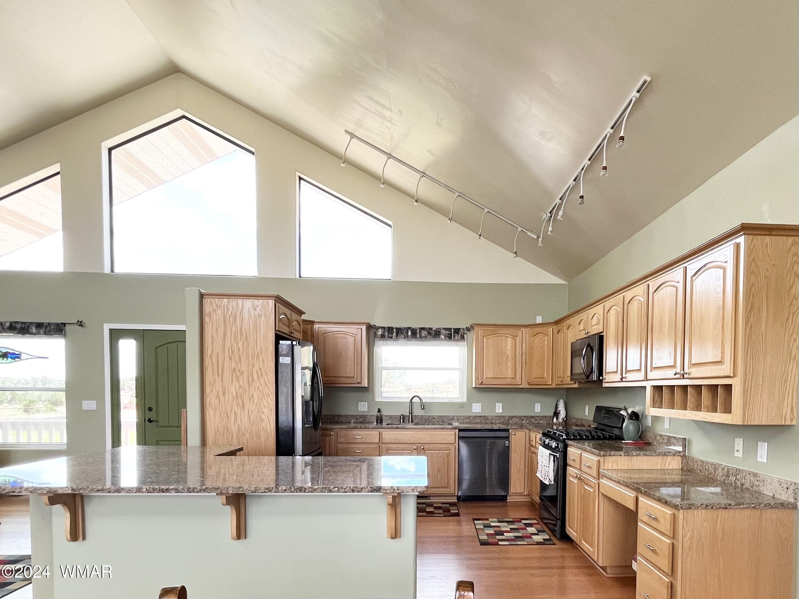 1968 West 7th S Street Snowflake, AZ 85937 - Photo 11 of 39 a kitchen with a sink a counter top space and stainless steel appliances