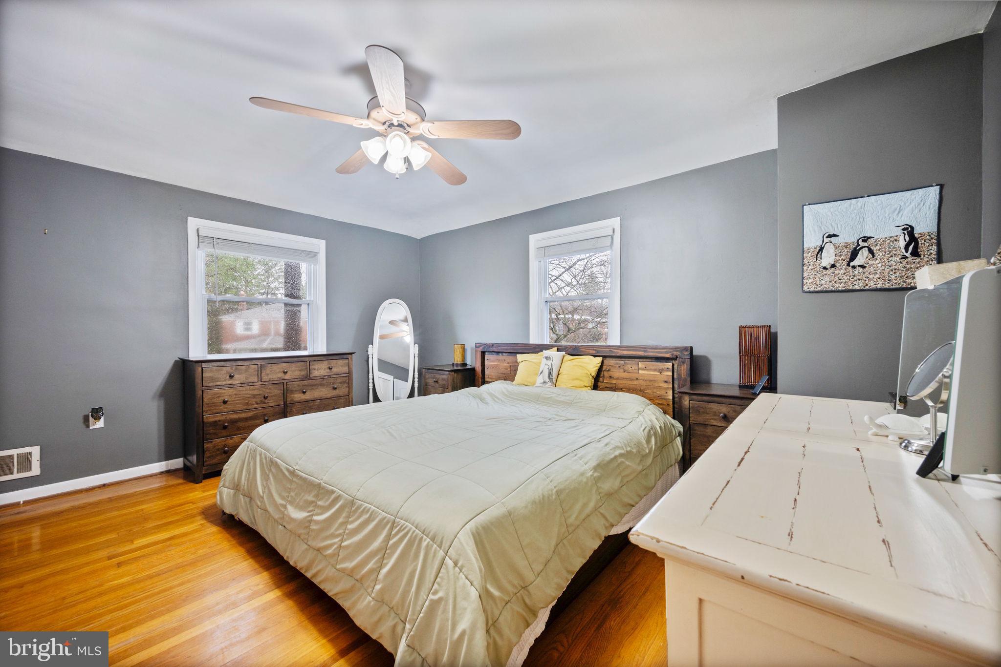 1311 Glenmont Road Baltimore, MD 21239 - Photo 14 of 49 Serene bedroom with modern charm.