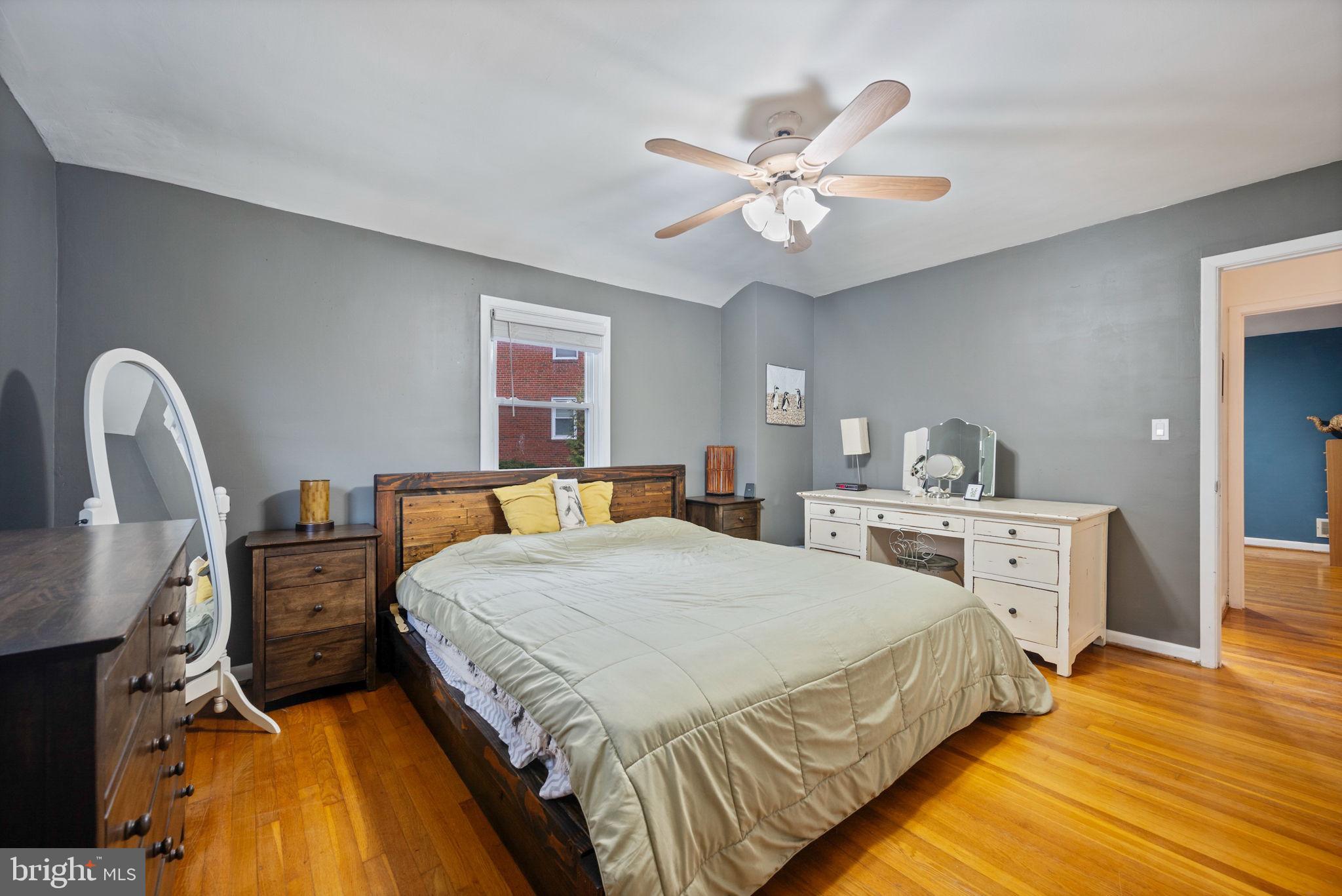 1311 Glenmont Road Baltimore, MD 21239 - Photo 15 of 49 Serene bedroom with modern charm.