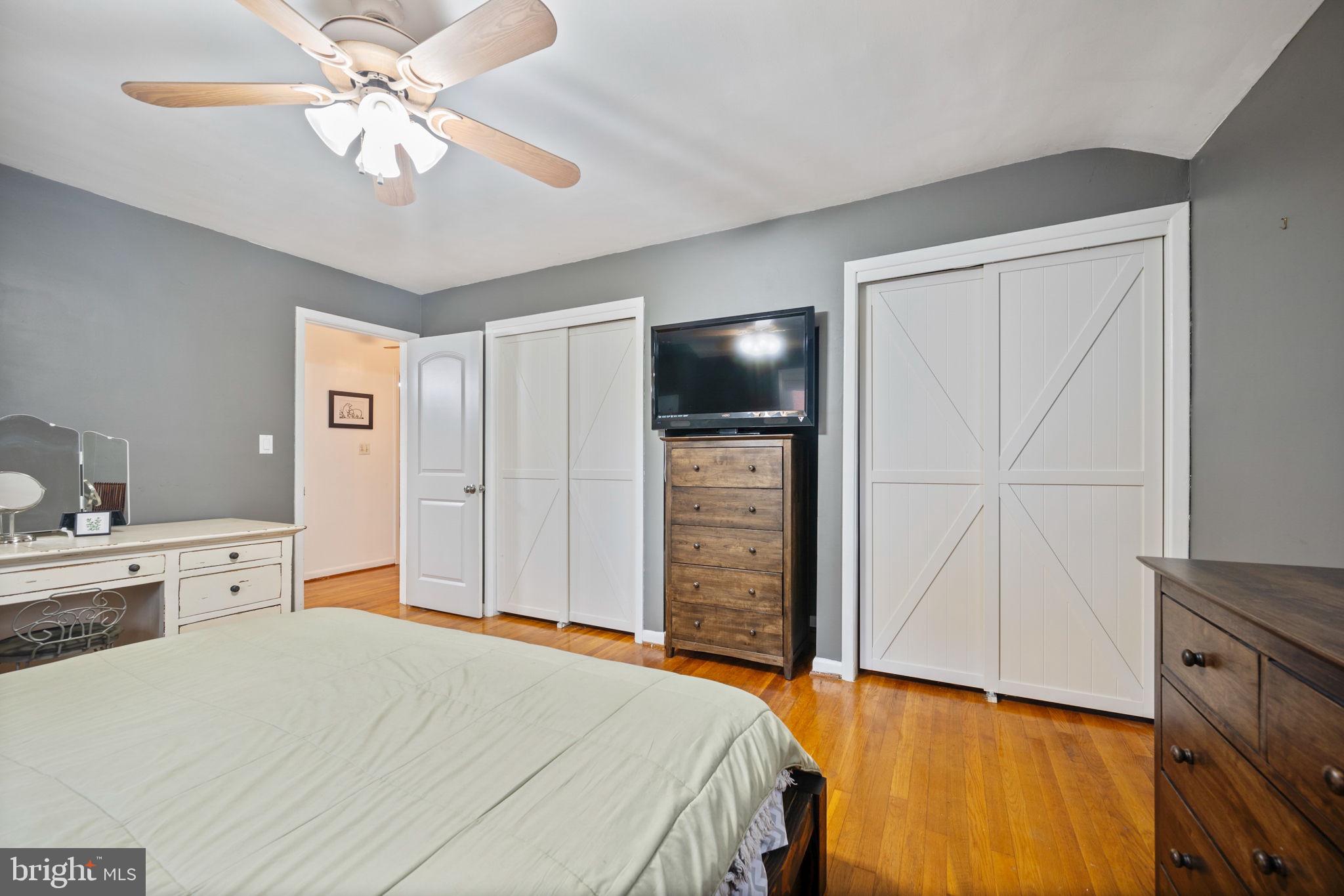 1311 Glenmont Road Baltimore, MD 21239 - Photo 16 of 49 Cozy bedroom with modern charm.