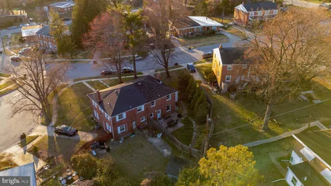 a aerial view of a house with a yard