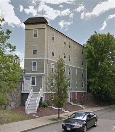a car parked in front of a house