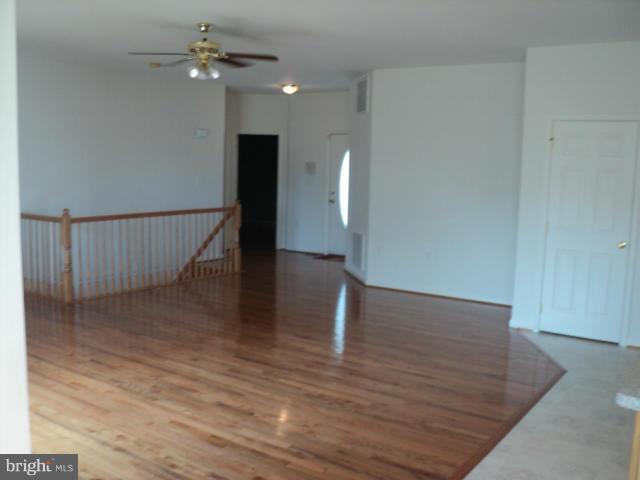 56 Peter Rabbit Drive Ranson, WV 25438 - Photo 12 of 28 a view of empty room with wooden floor