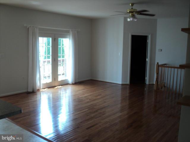56 Peter Rabbit Drive Ranson, WV 25438 - Photo 13 of 28 a view of an empty room with wooden floor and a window