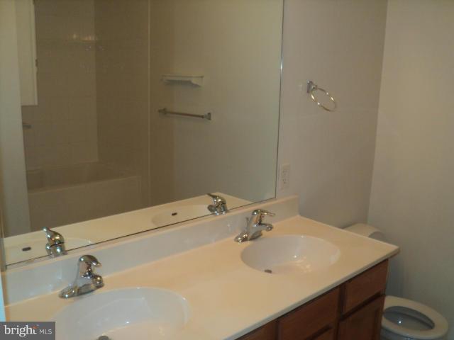 56 Peter Rabbit Drive Ranson, WV 25438 - Photo 16 of 28 a bathroom with a sink and a toilet