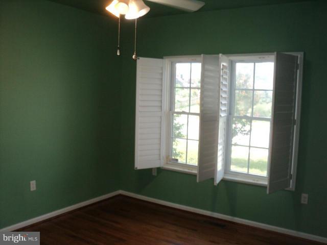 56 Peter Rabbit Drive Ranson, WV 25438 - Photo 18 of 28 a room with a window and wooden floor