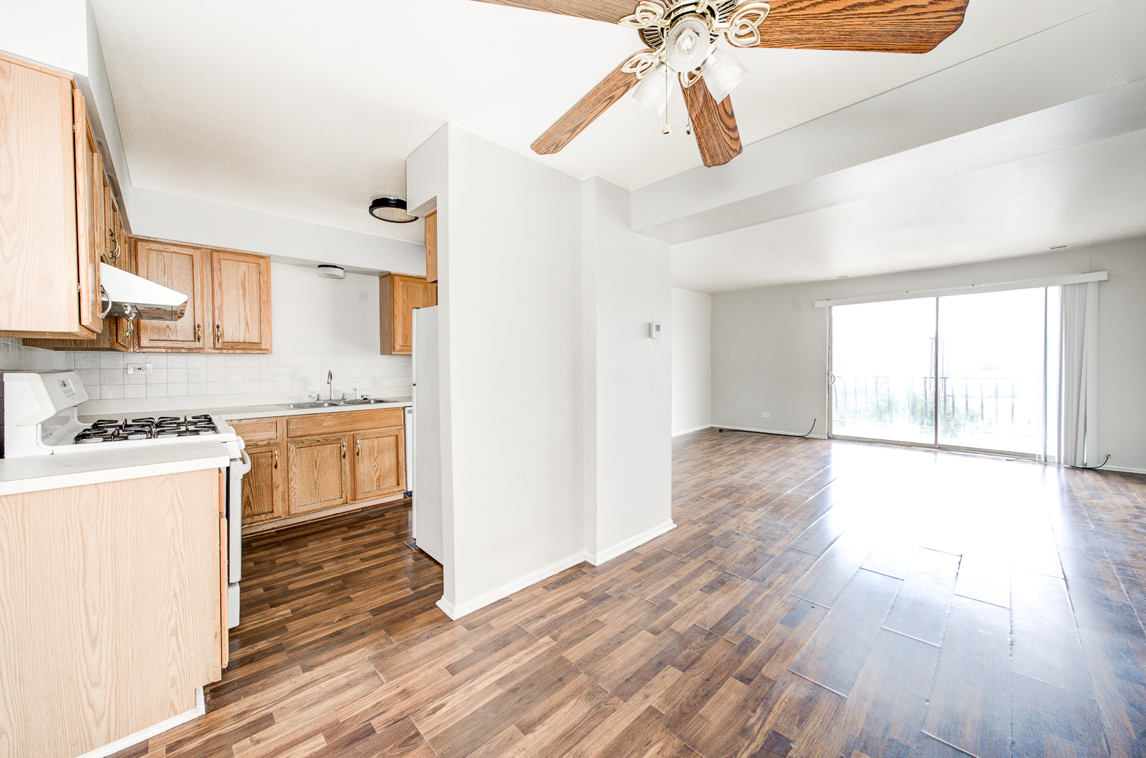 12741 South La Crosse Avenue, Unit 3A Alsip, IL 60803 - Photo 3 of 13 a kitchen with a hard wood floor white cabinets and white appliances