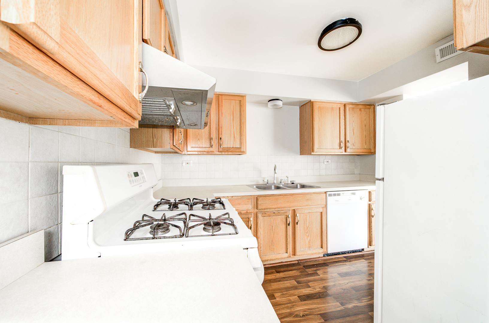 12741 South La Crosse Avenue, Unit 3A Alsip, IL 60803 - Photo 4 of 13 a kitchen with a sink a stove and cabinets