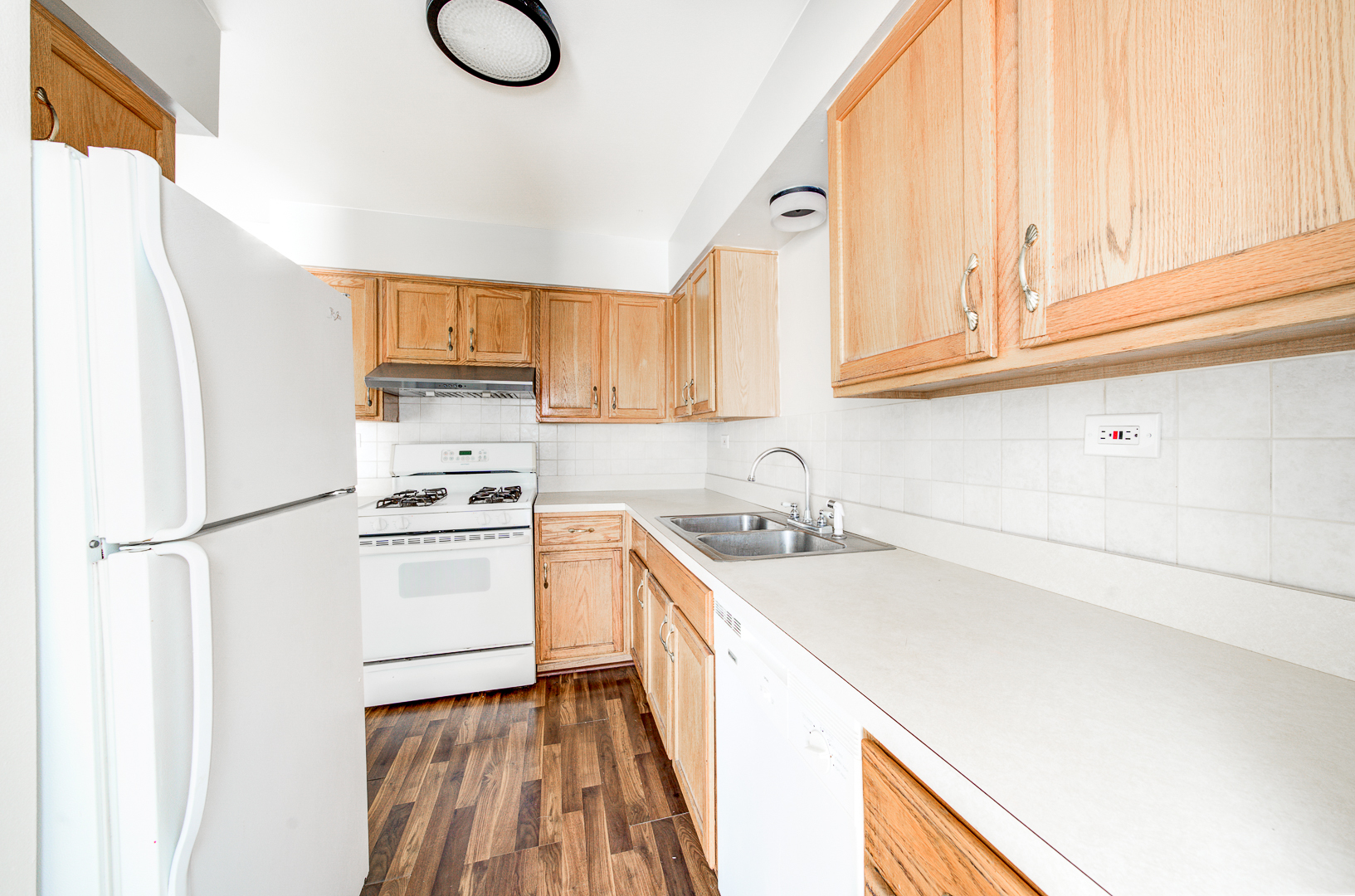 12741 South La Crosse Avenue, Unit 3A Alsip, IL 60803 - Photo 5 of 13 a kitchen with a sink a refrigerator and a stove