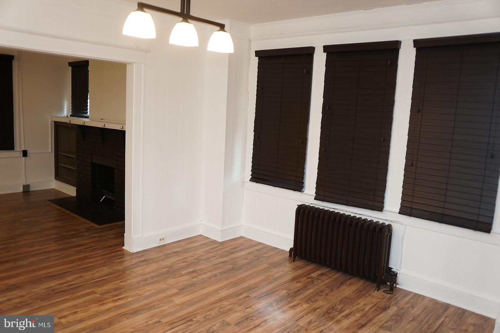 4105 Chatham Road Baltimore, MD 21207 - Photo 8 of 41 Spacious dining room leading into kitchen