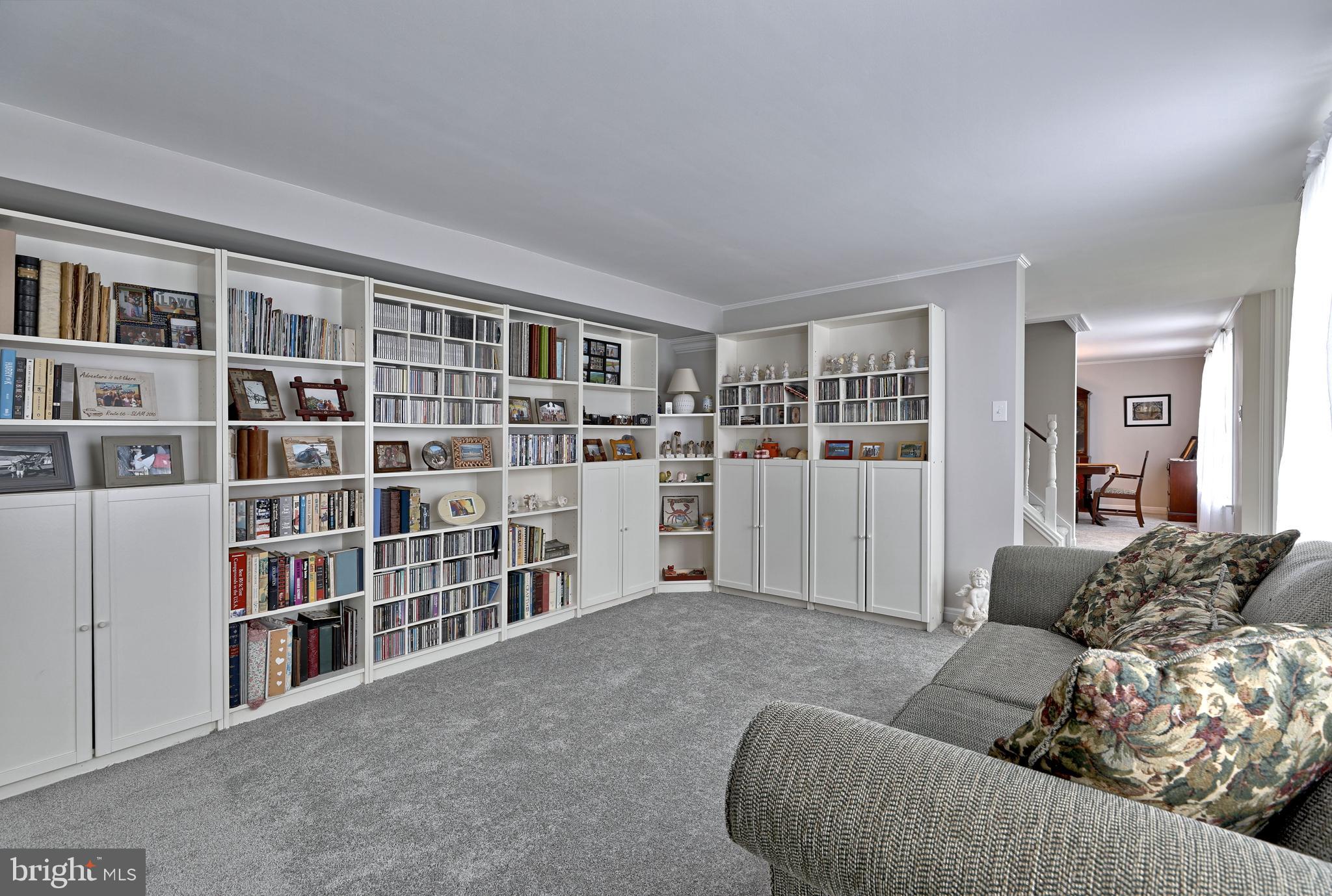 8 Meadow Drive Moorestown, NJ 08057 - Photo 12 of 36 a living room with furniture and a book shelf