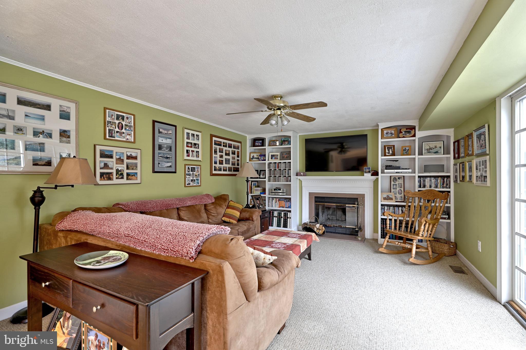 8 Meadow Drive Moorestown, NJ 08057 - Photo 14 of 36 a living room with furniture and a fireplace