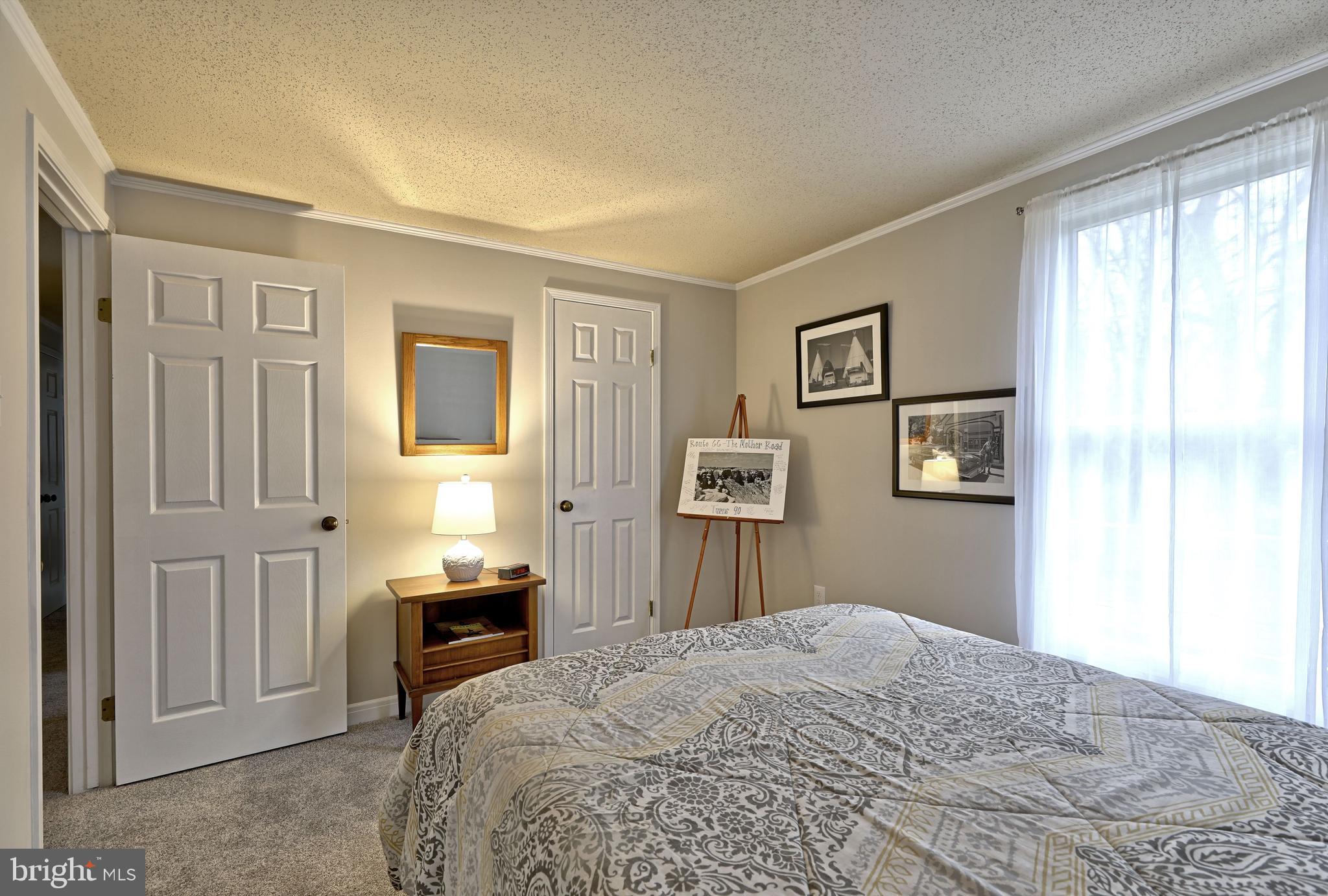 8 Meadow Drive Moorestown, NJ 08057 - Photo 27 of 36 a bedroom with a bed and a window