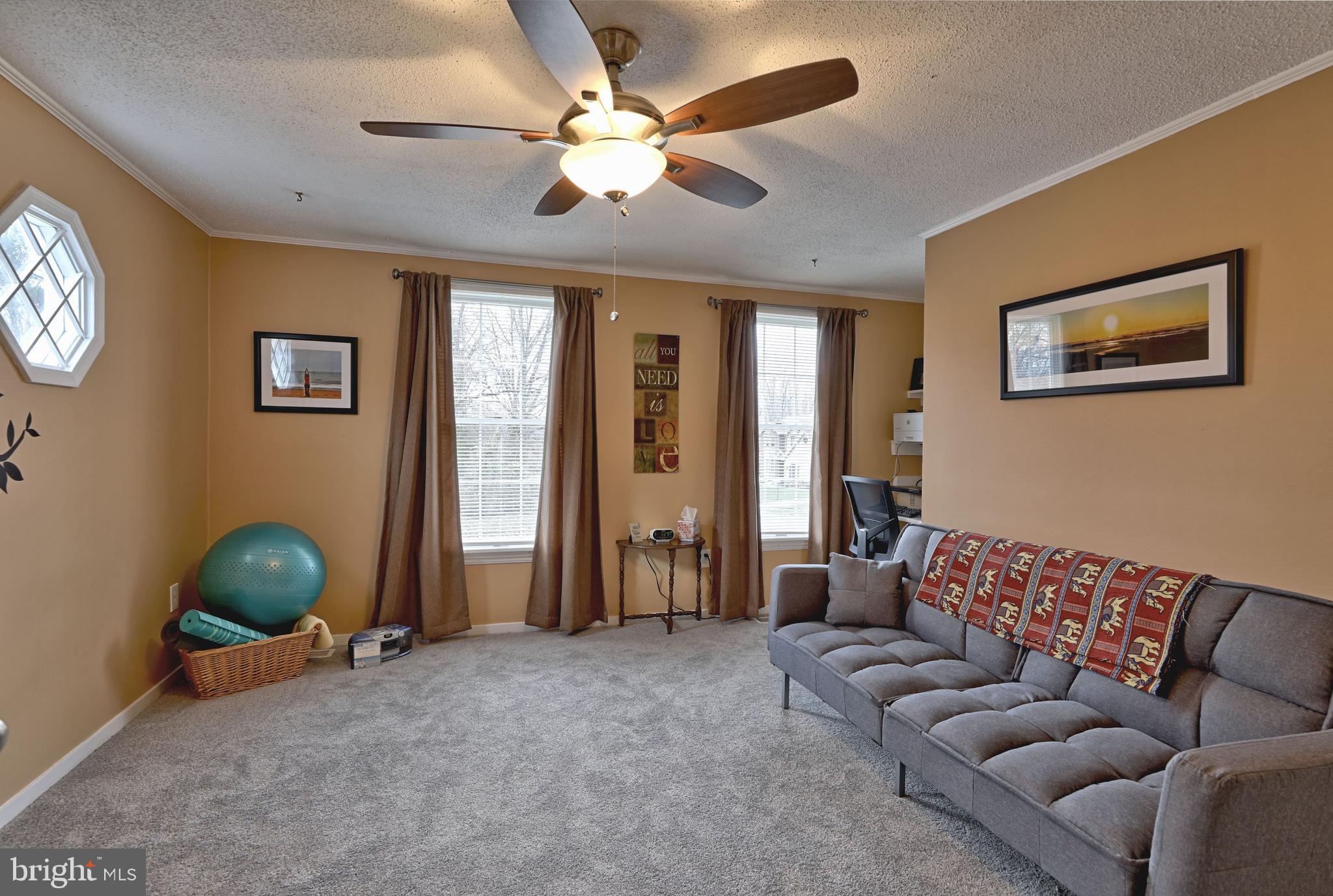 8 Meadow Drive Moorestown, NJ 08057 - Photo 29 of 36 a living room with furniture and a ceiling fan