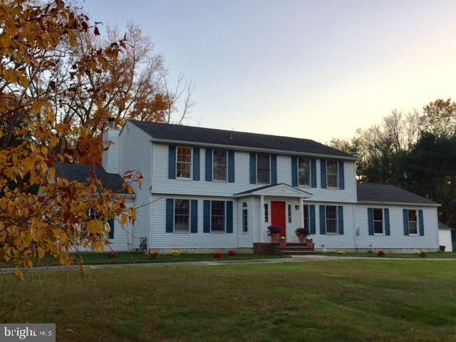 8 Meadow Drive Moorestown, NJ 08057 - Photo 33 of 36 a front view of a house with a garden