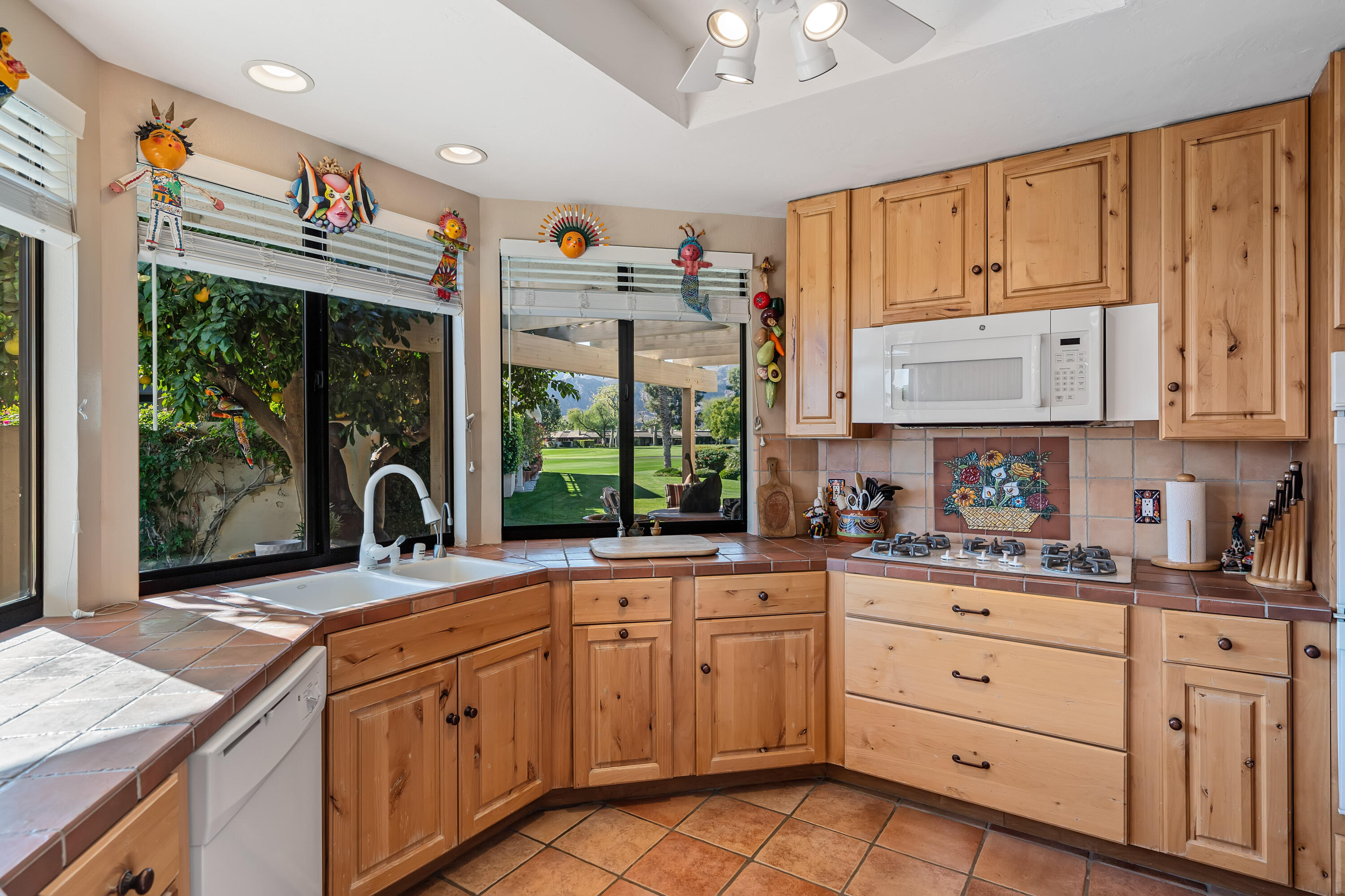 9 Swarthmore Court Rancho Mirage, CA 92270 - Photo 13 of 43 a kitchen with stainless steel appliances granite countertop a sink and cabinets