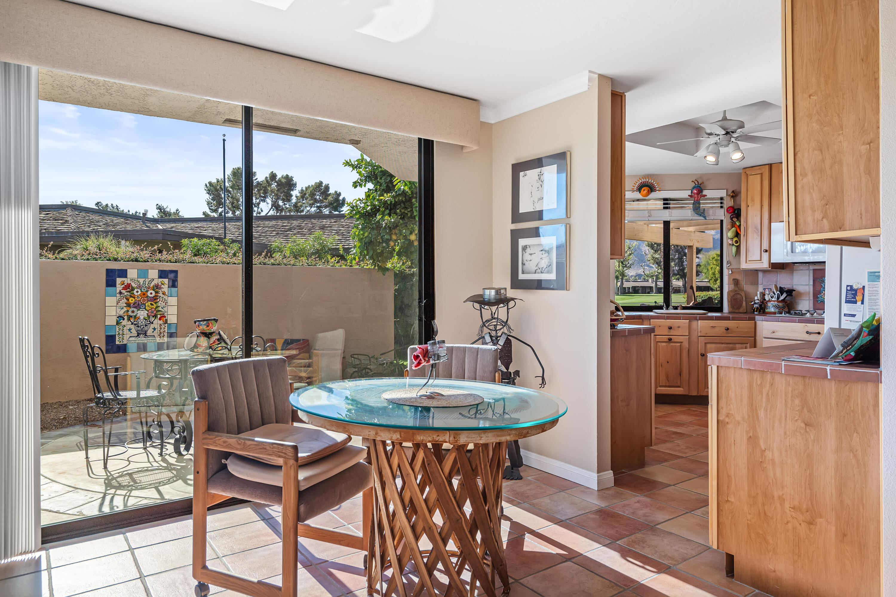 9 Swarthmore Court Rancho Mirage, CA 92270 - Photo 15 of 43 a view of a dining room with furniture large windows and wooden floor