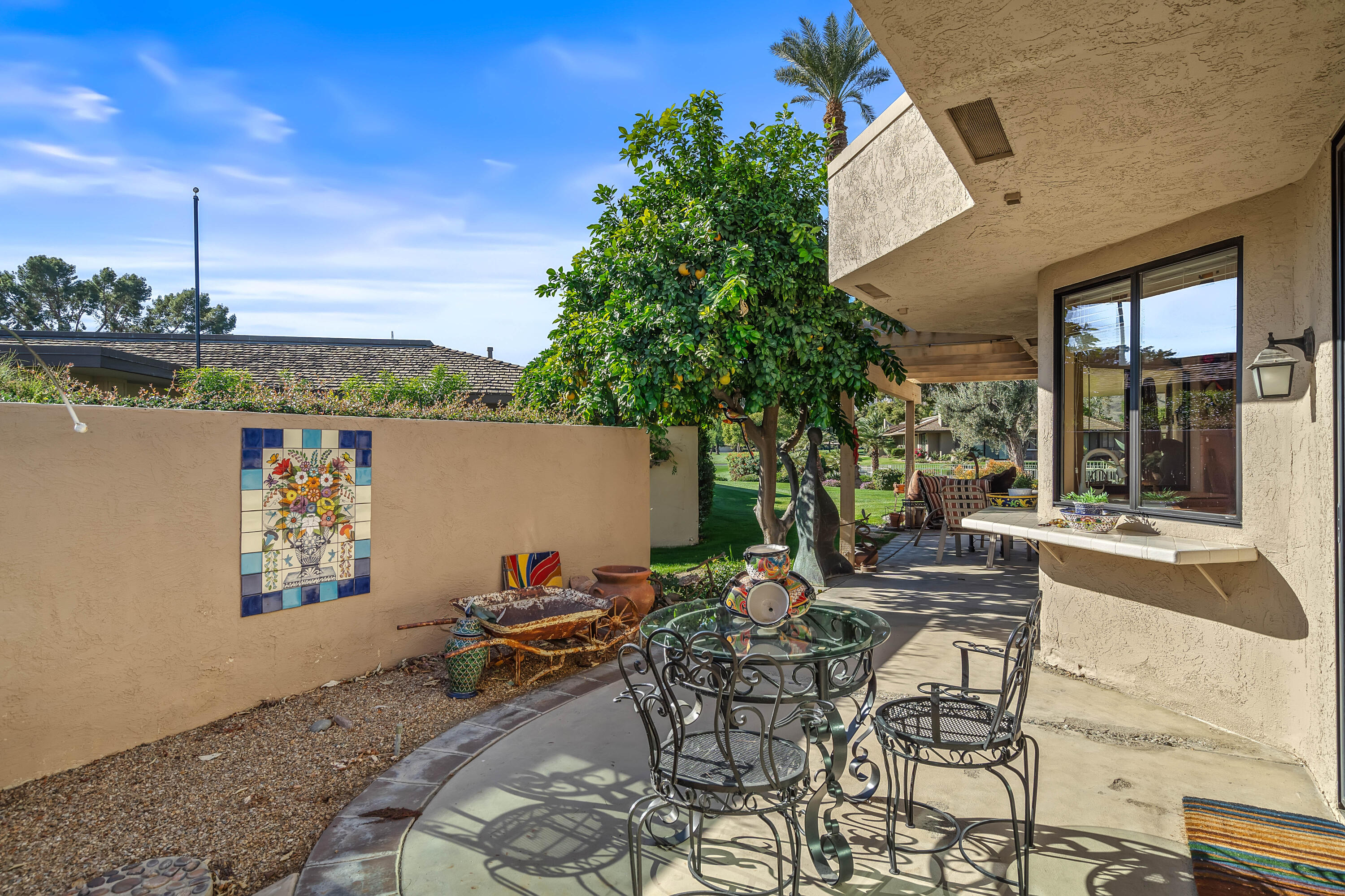 9 Swarthmore Court Rancho Mirage, CA 92270 - Photo 16 of 43 a view of swimming pool with outdoor seating and plants