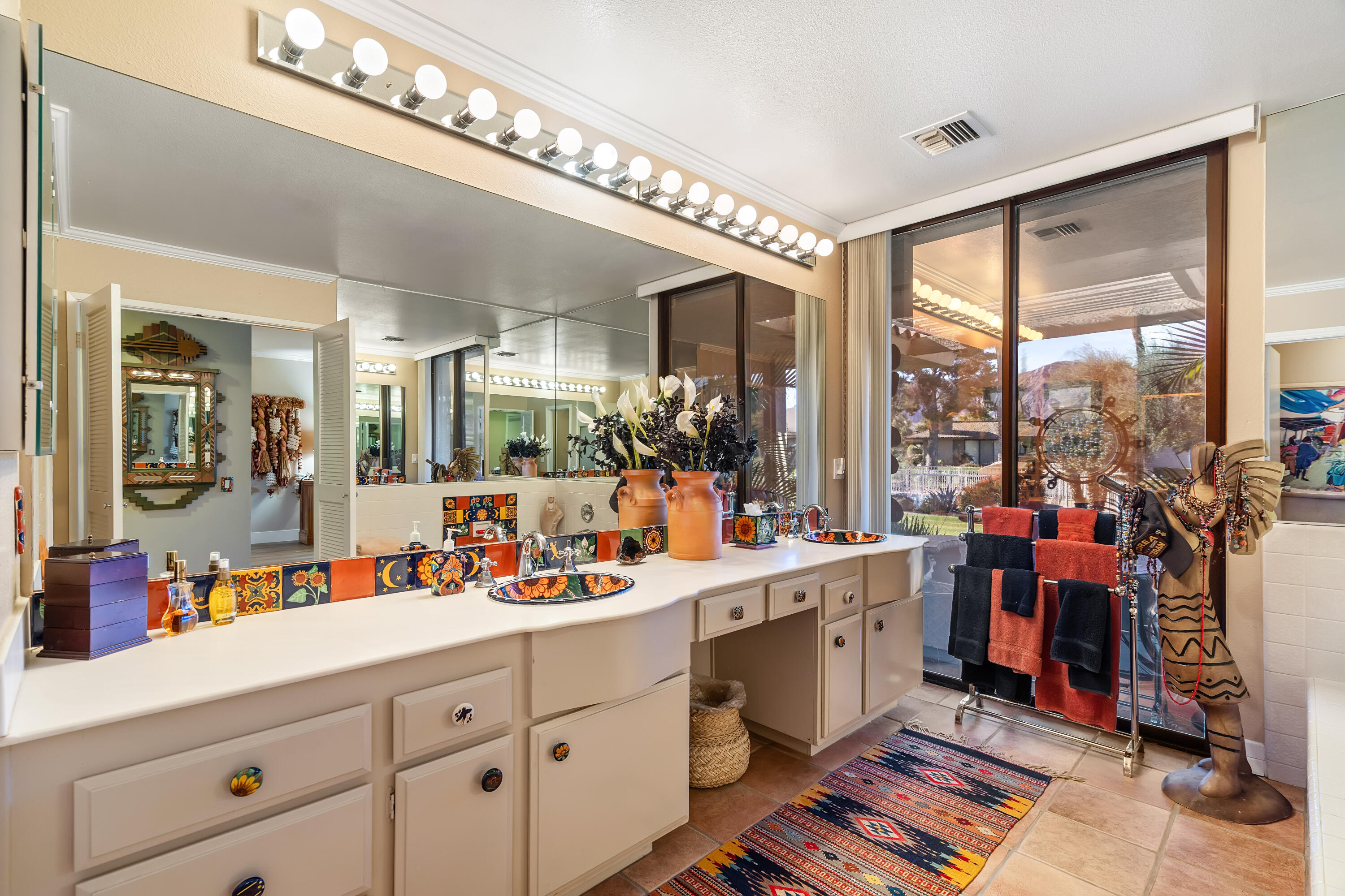 9 Swarthmore Court Rancho Mirage, CA 92270 - Photo 21 of 43 a large white kitchen with a large window