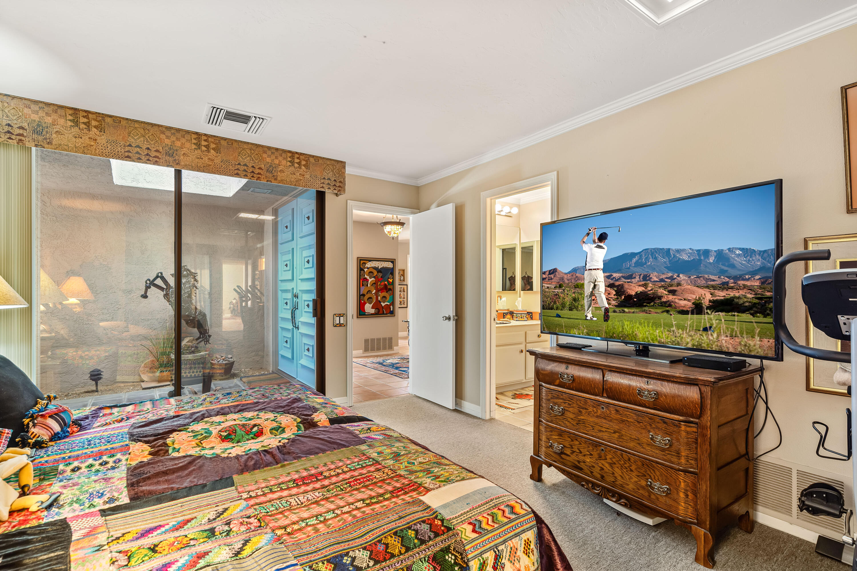 9 Swarthmore Court Rancho Mirage, CA 92270 - Photo 24 of 43 a bedroom with a bed and a flat screen tv