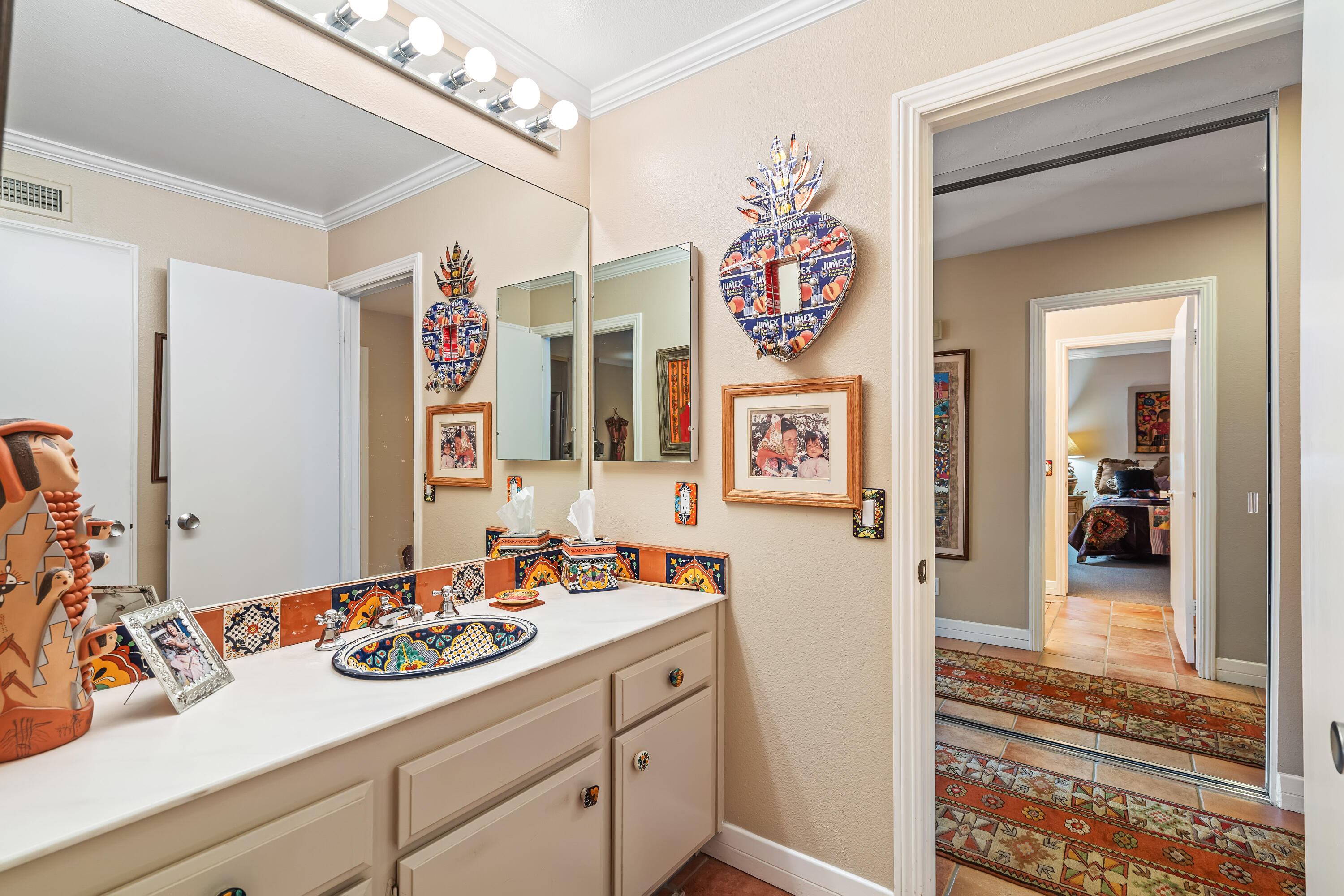 9 Swarthmore Court Rancho Mirage, CA 92270 - Photo 25 of 43 a bathroom with a sink and a mirror